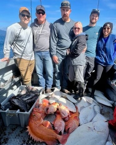 A group of 6 people enjoying a scenic cruises, fishing, and tours adventure in Homer.