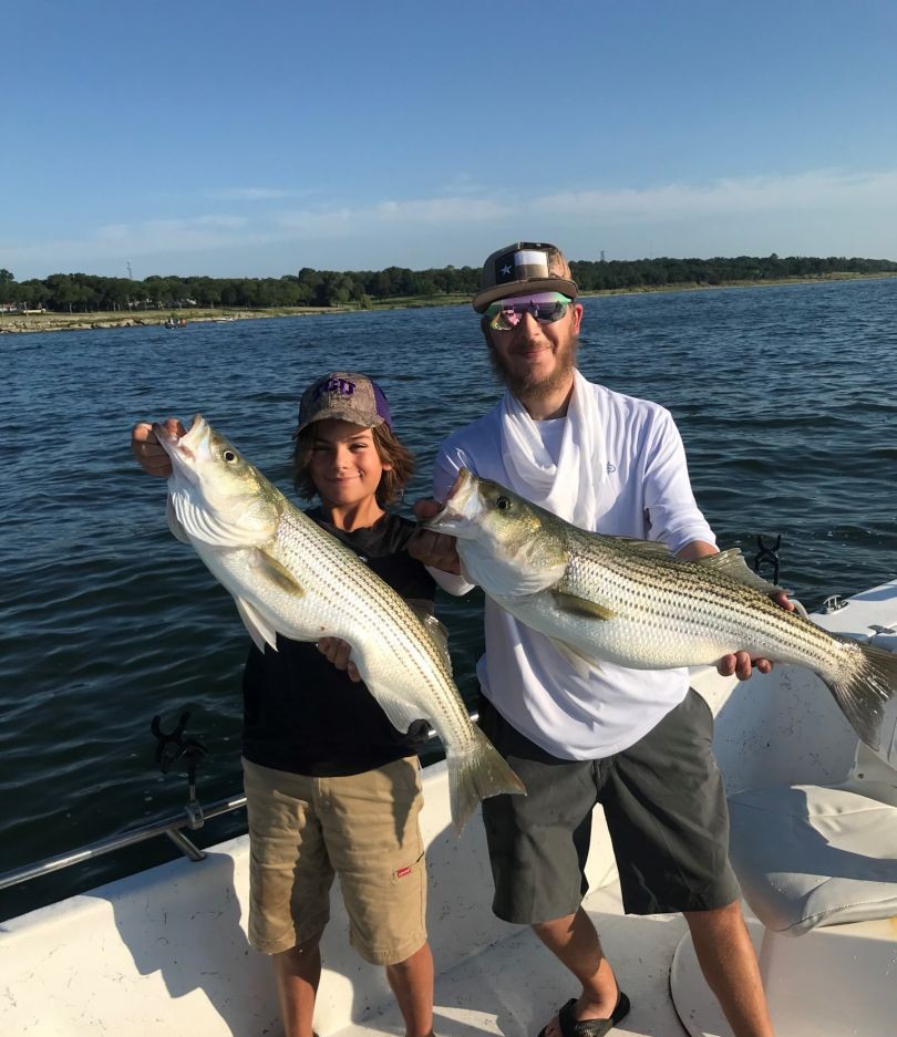 Two striped bass, each measuring 27 inches, caught while fishing in TX.