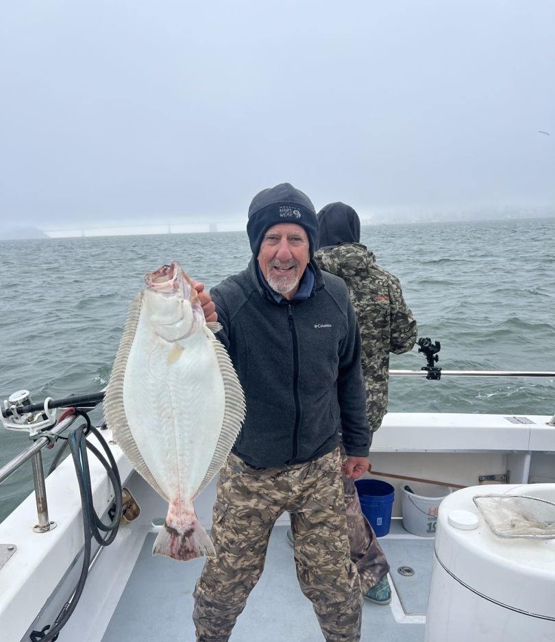 Angler catches a large summer flounder in San Francisco