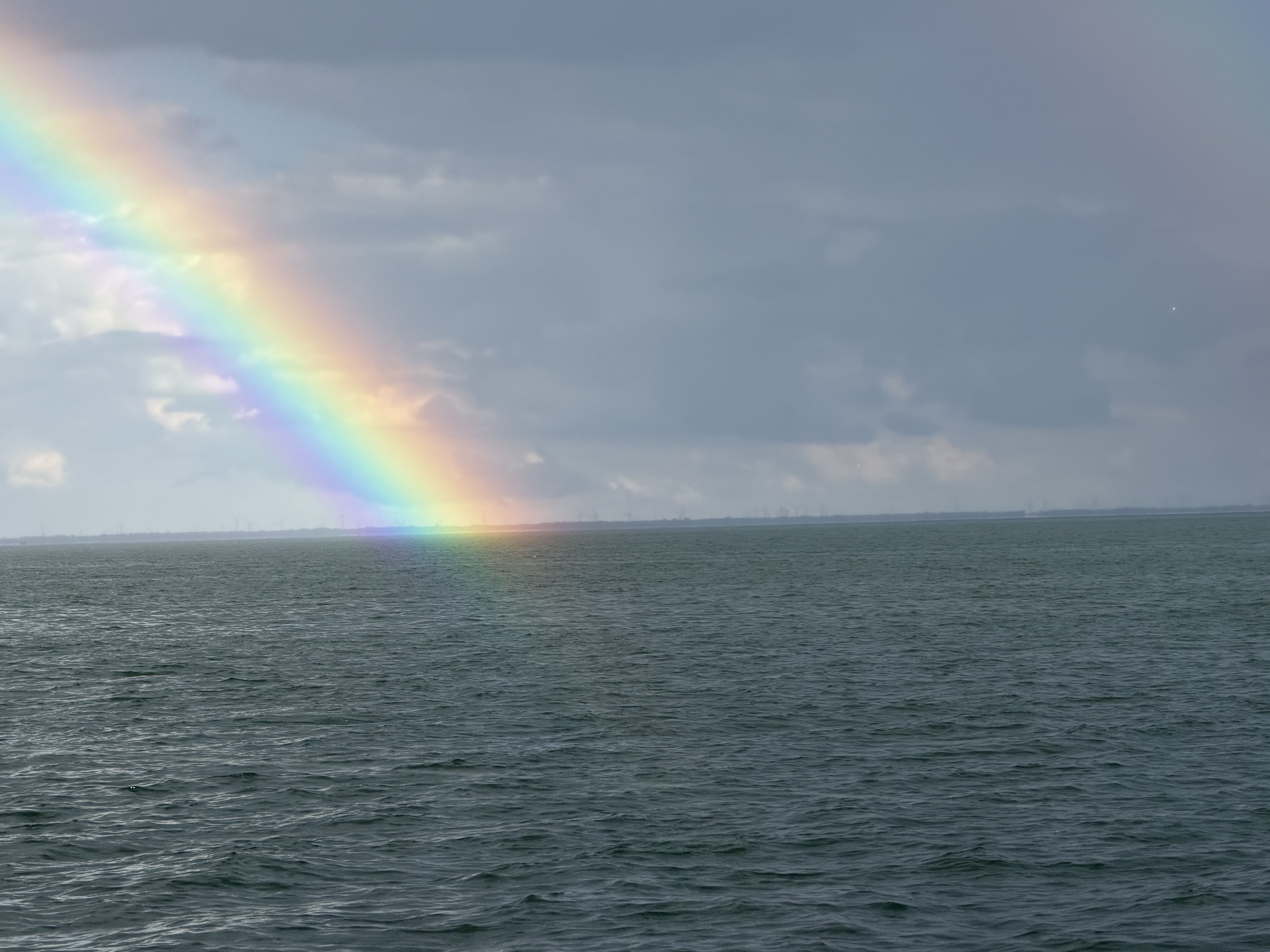 Rainbow arcing over water in Bay City Michigan fishing location
