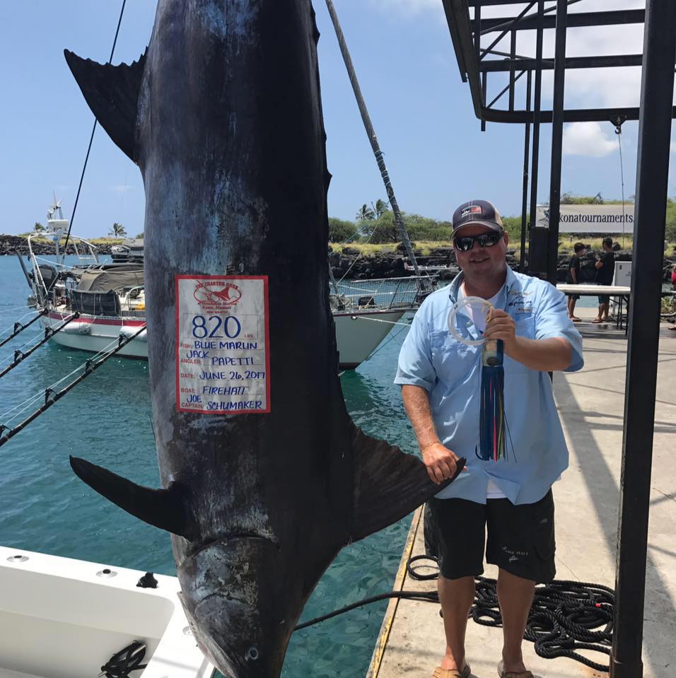 Angler holds a 61-inch fishing catch in HI