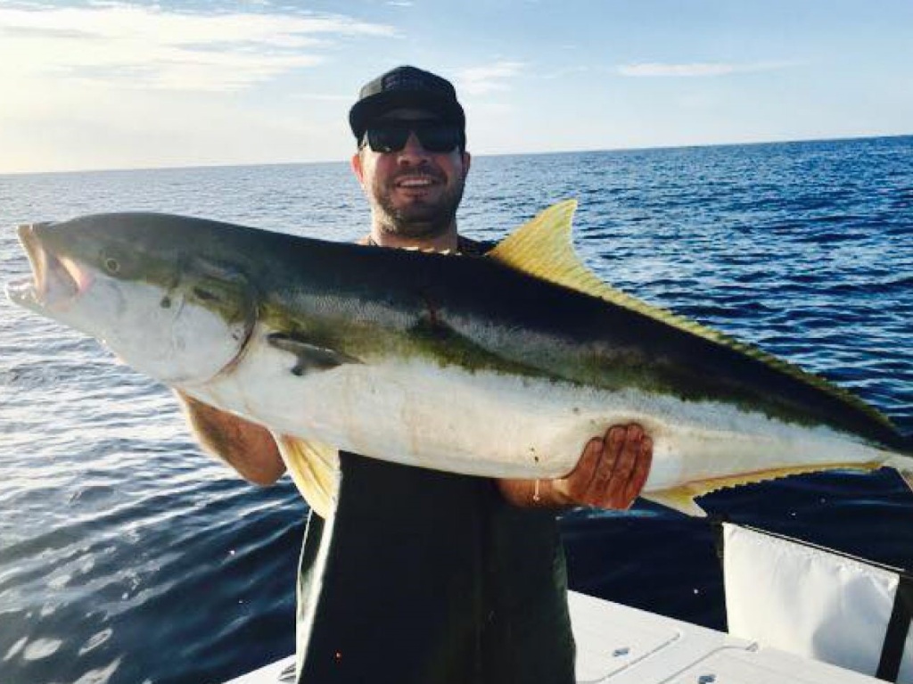 A single fisherman enjoys a successful day of fishing in CA.
