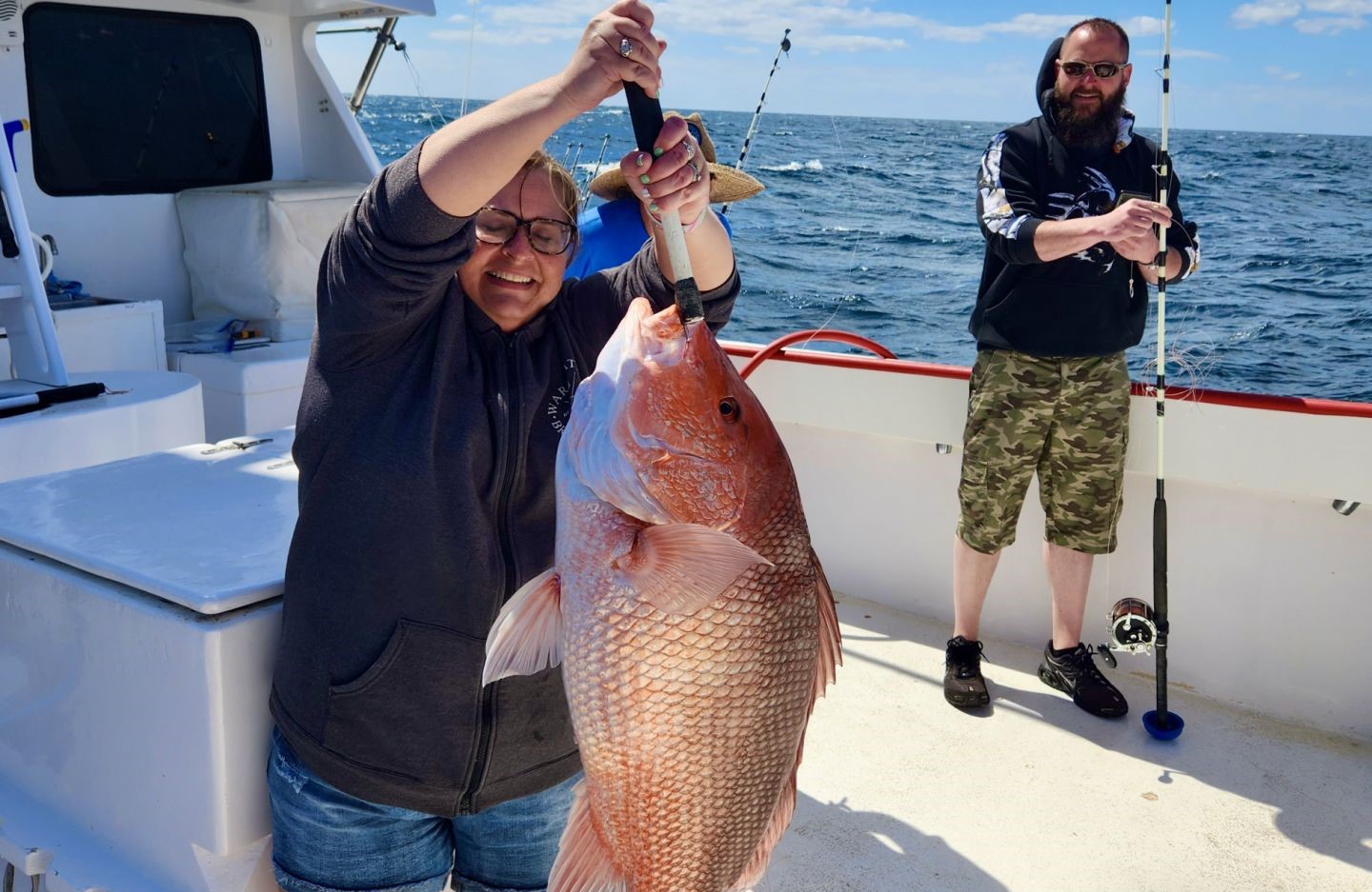 Two anglers holding a large fish in Florida
