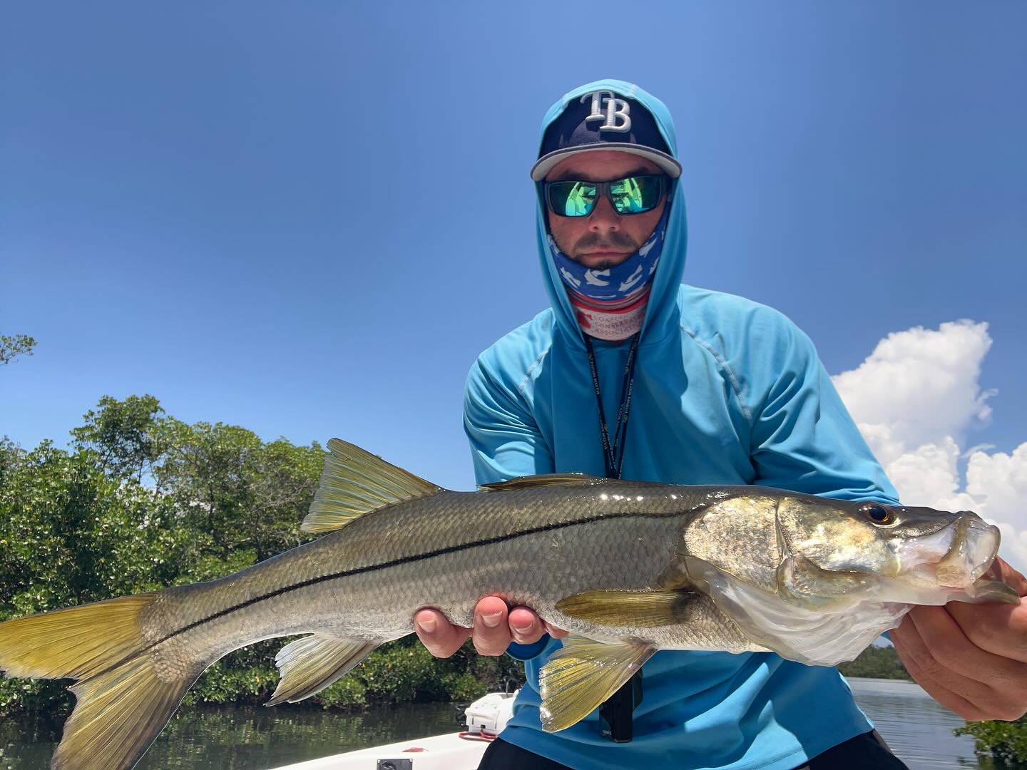 Fisherman catching a snook in Ruskin
