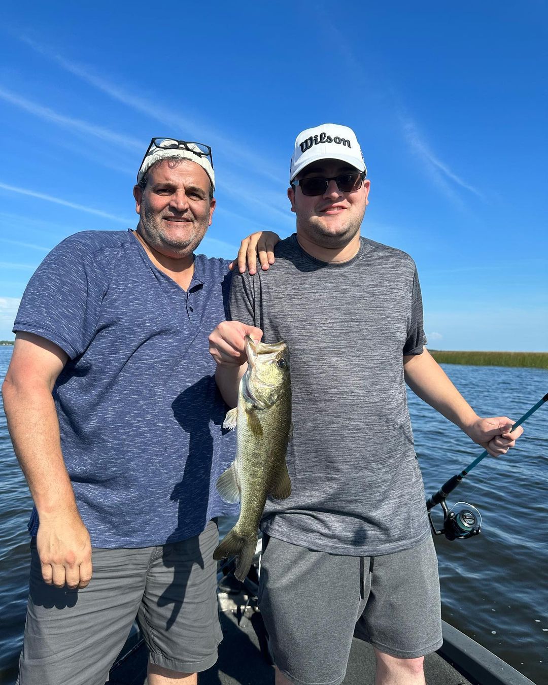 Largemouth bass caught by two people in St. Cloud