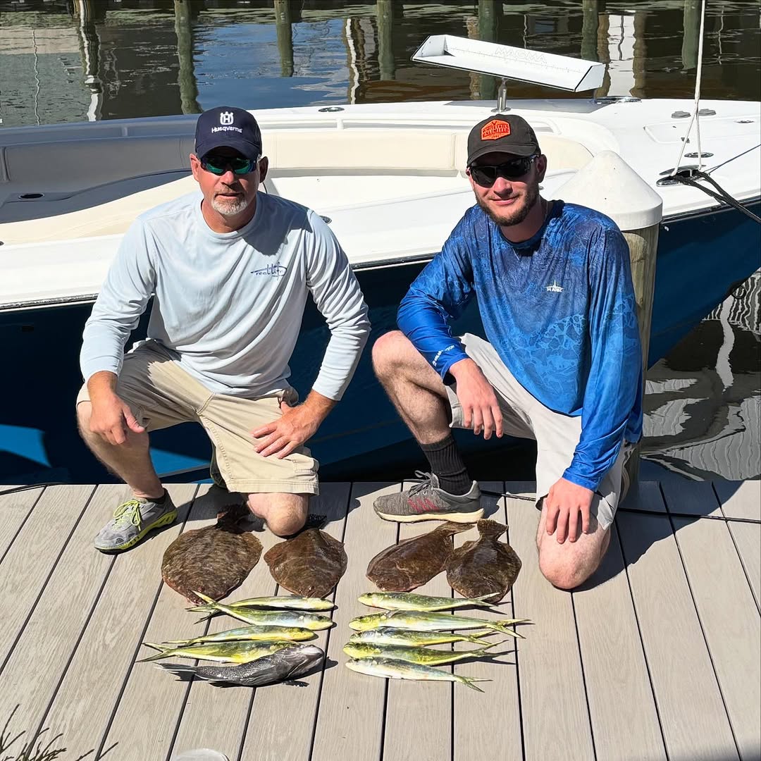 Two anglers enjoying a scenic cruises fishing trip in NJ