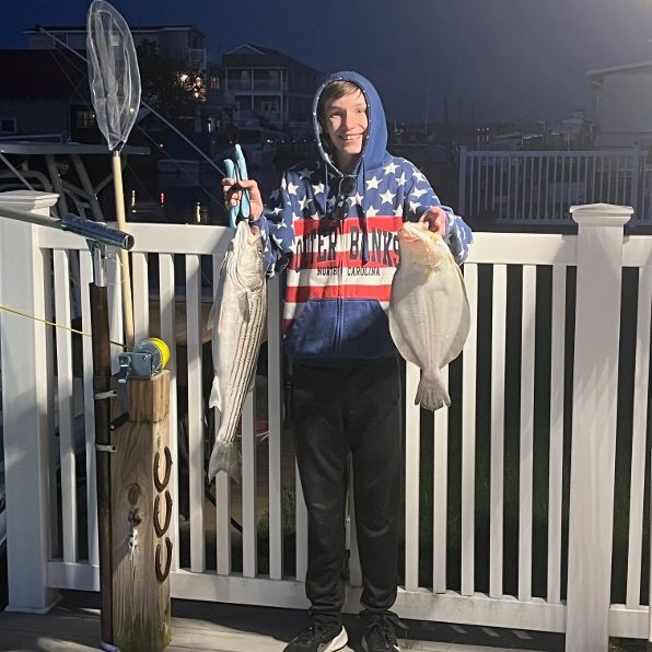 A person fishing in the waters of New Jersey