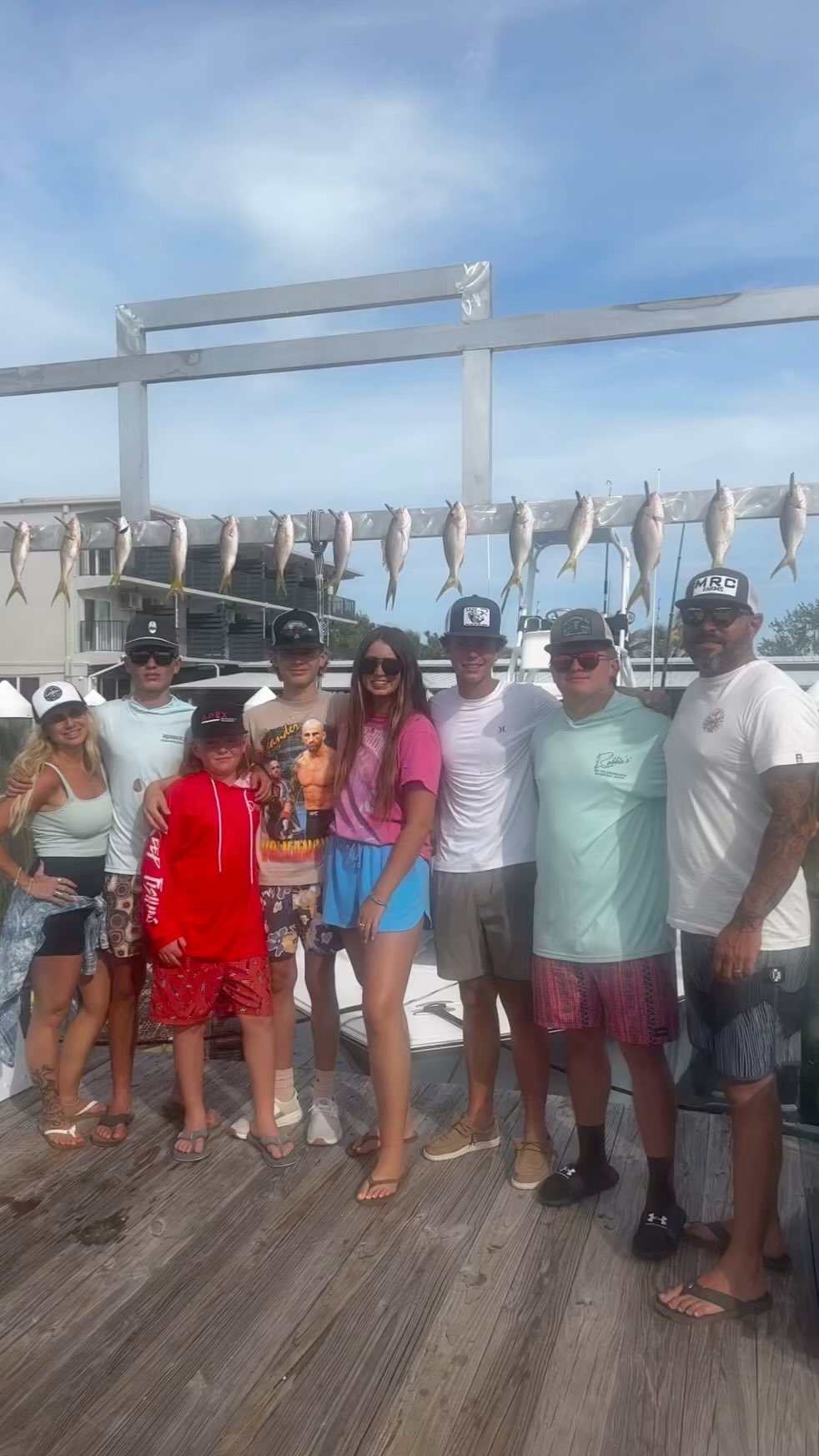 Group of 9 people enjoying fishing tours in Islamorada