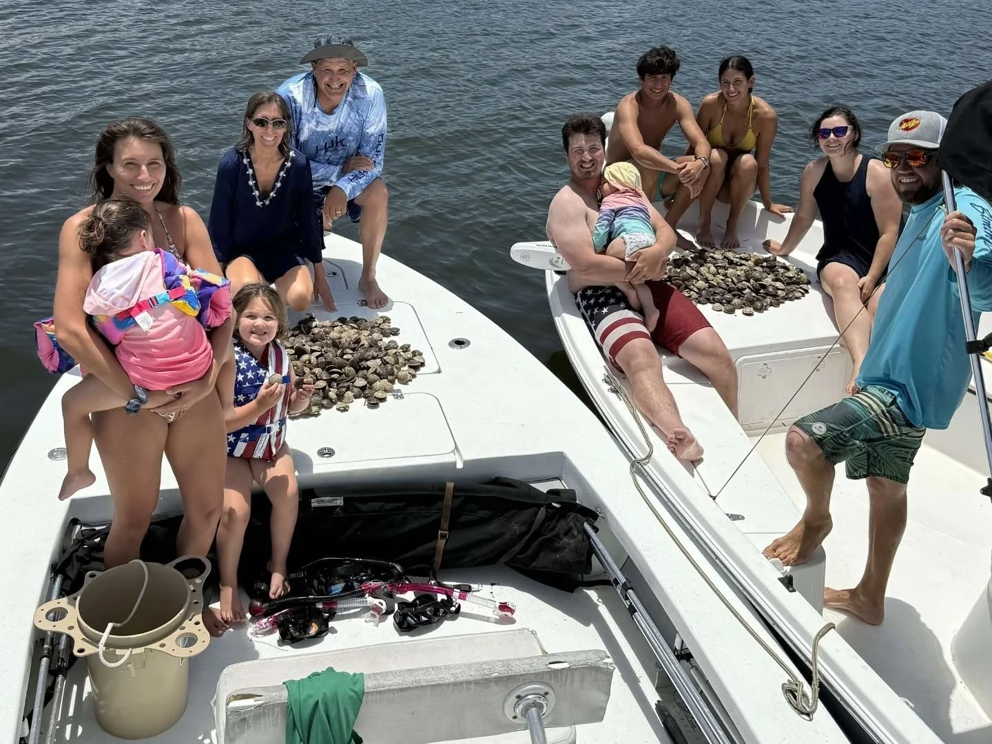 Scalloping charter boat on Crystal River waters with divers collecting scallops in shallow grass flats