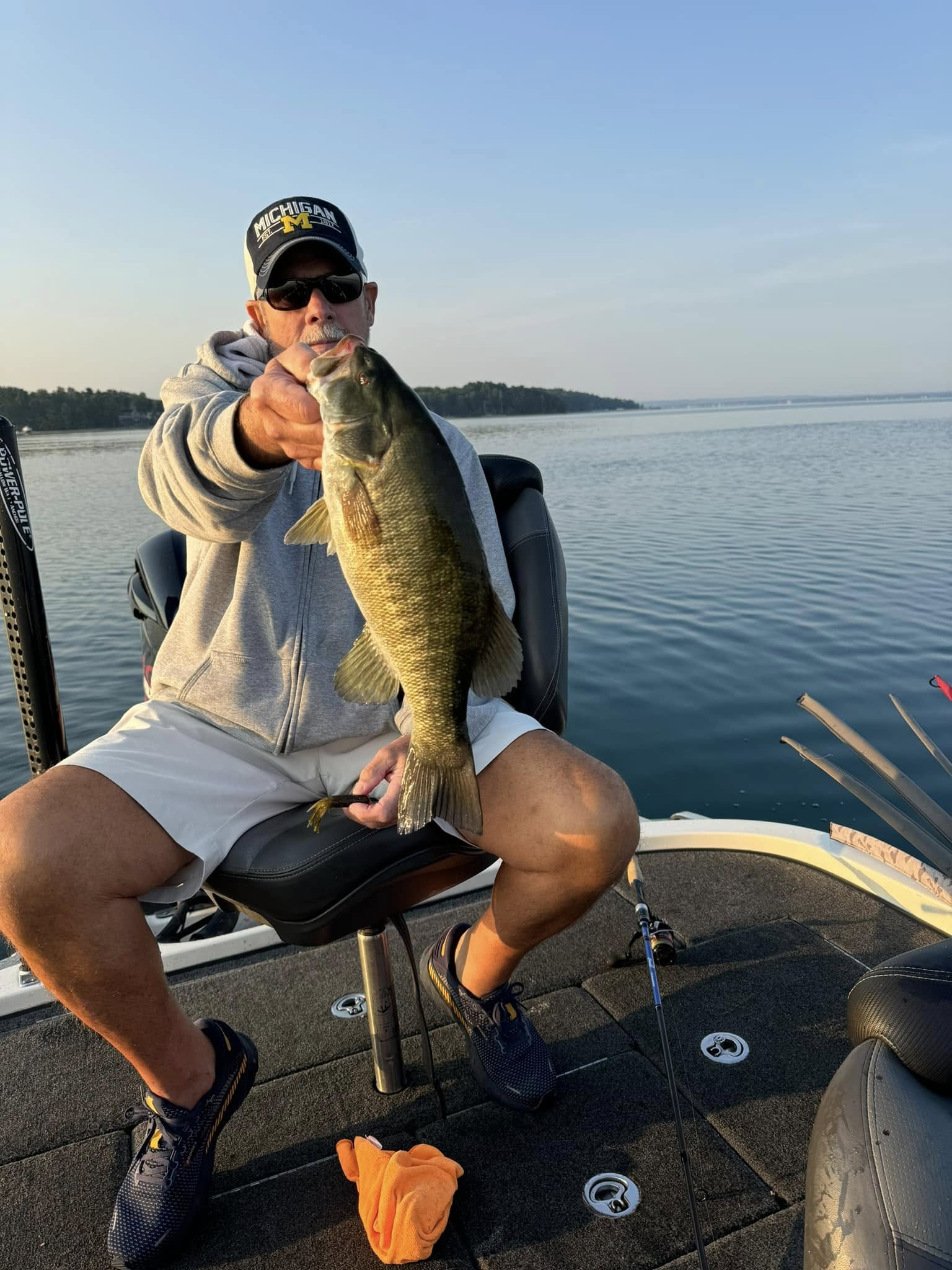 A lone angler reeling in a big catch in Traverse City