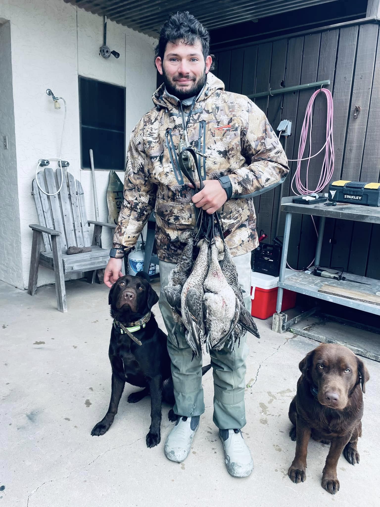 Successful duck hunting trip in Port O'Connor TX with hunting dogs and harvested waterfowl