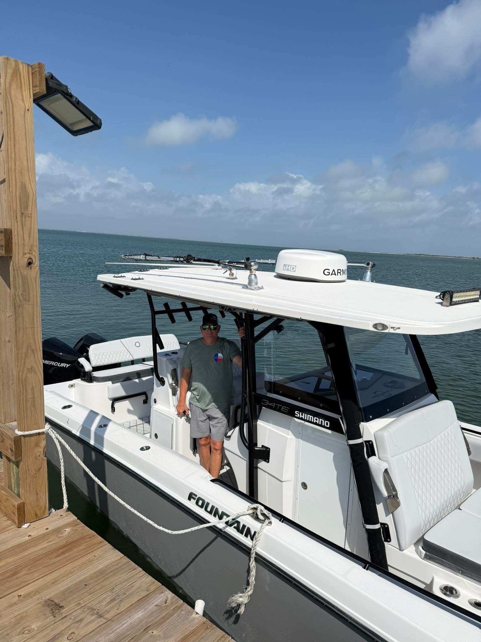 White Fountain fishing boat docked at marina in Port O'Connor TX with T-top and electronics