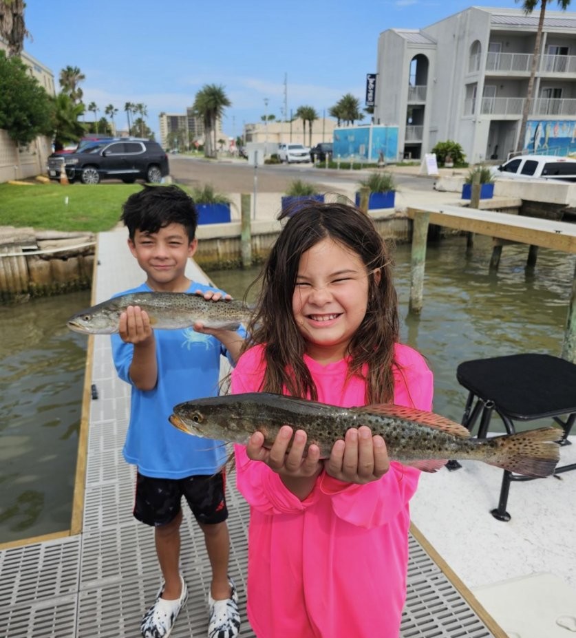 Kids-friendly inshore fishing charter boat with family anglers on South Padre Island waters