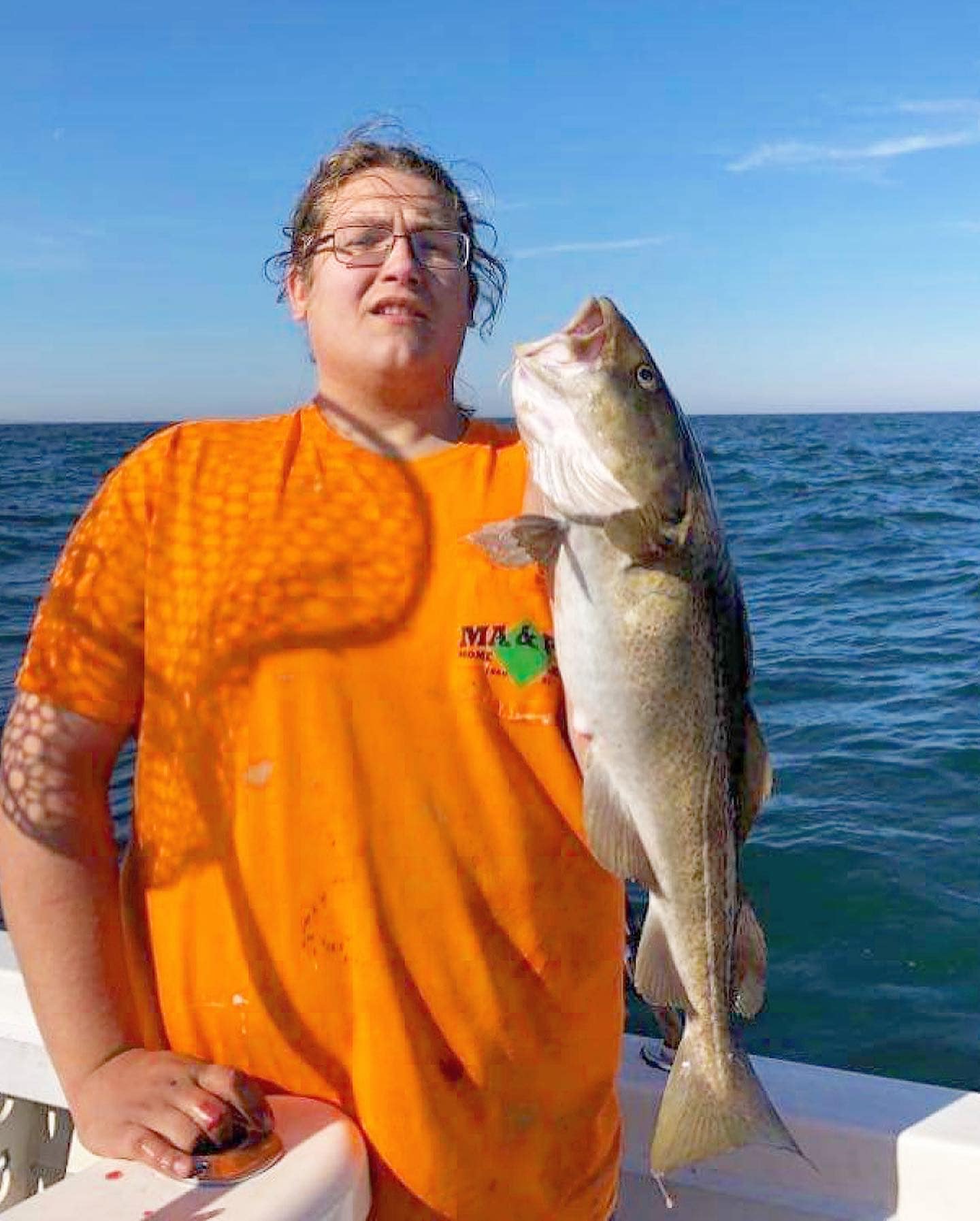 Angler with a 24-inch fish in Groton