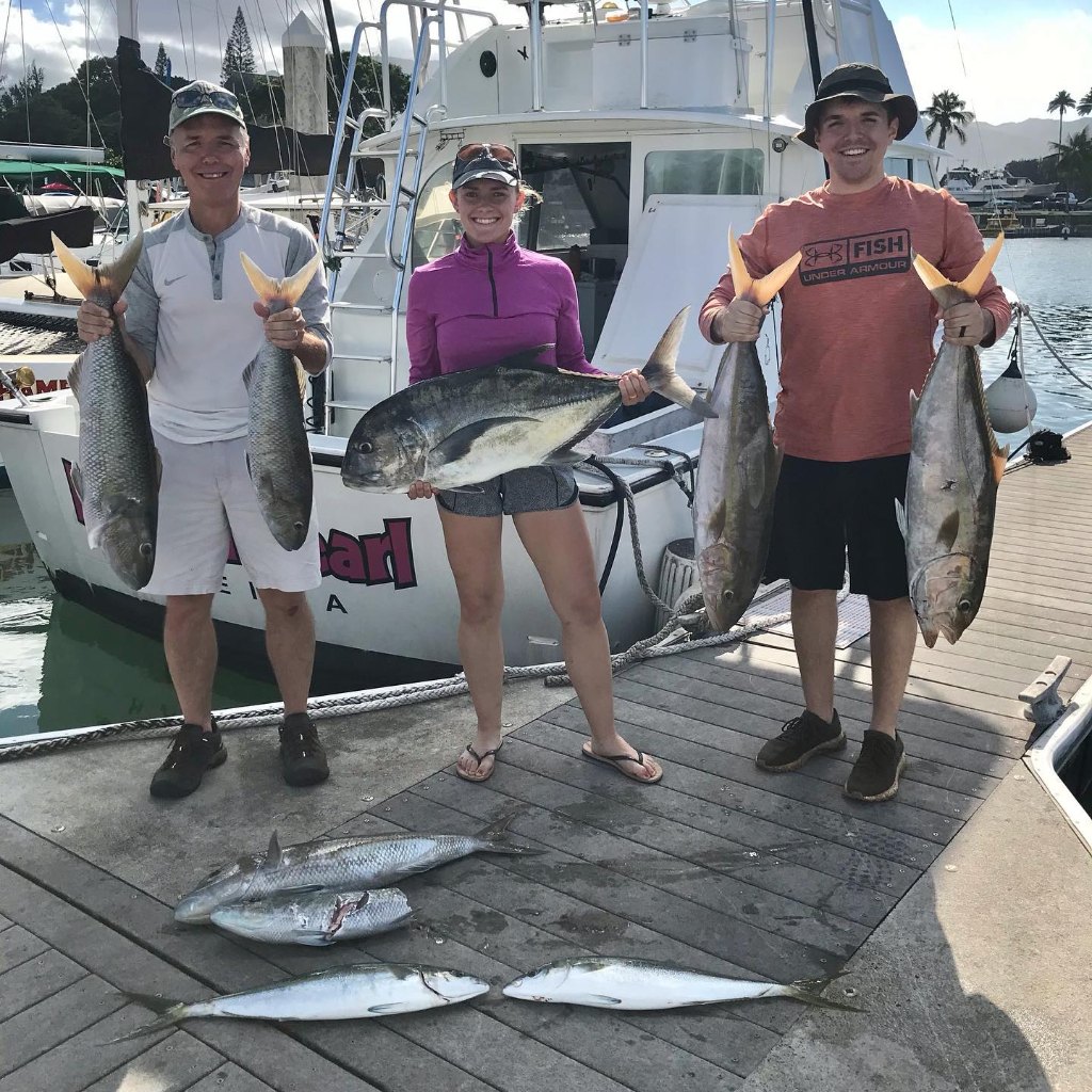 Seven giant trevally and cero mackerel fish in HI