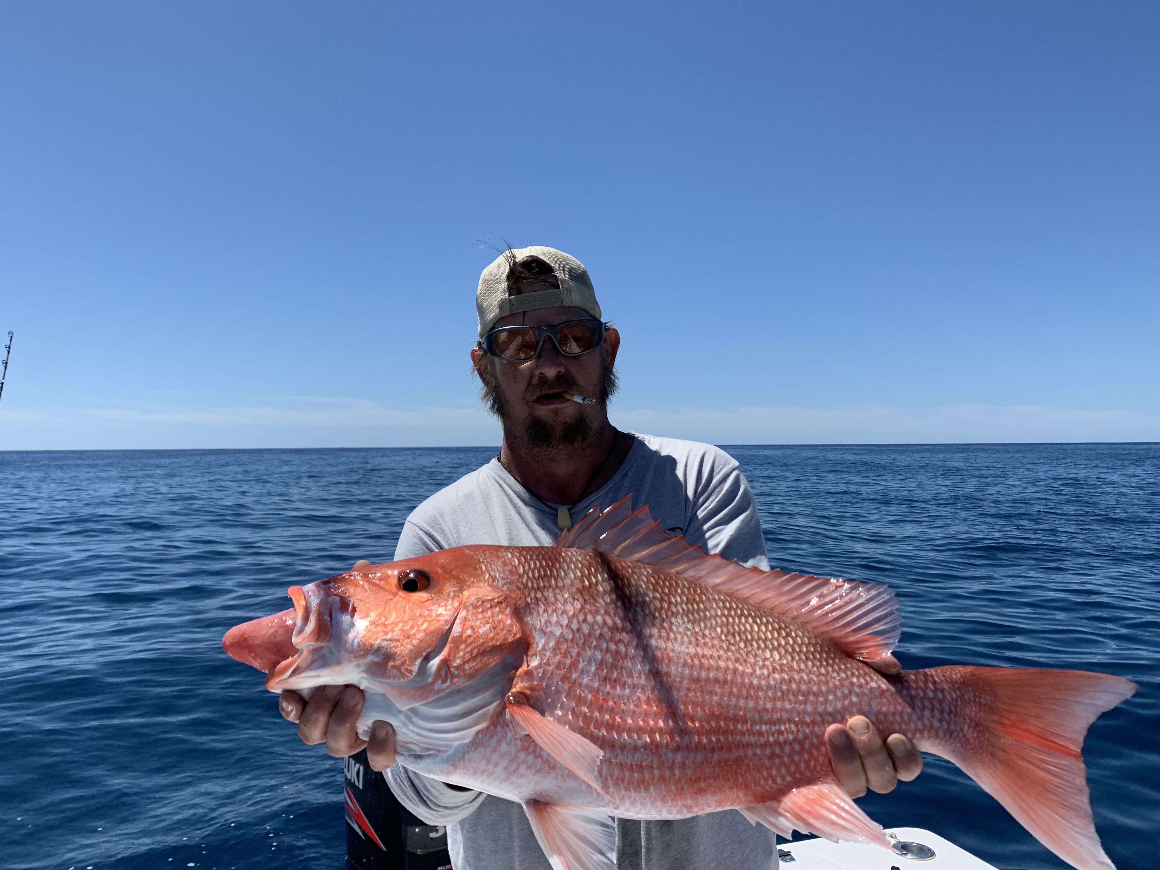 A person fishing in the waters of Cape Canaveral