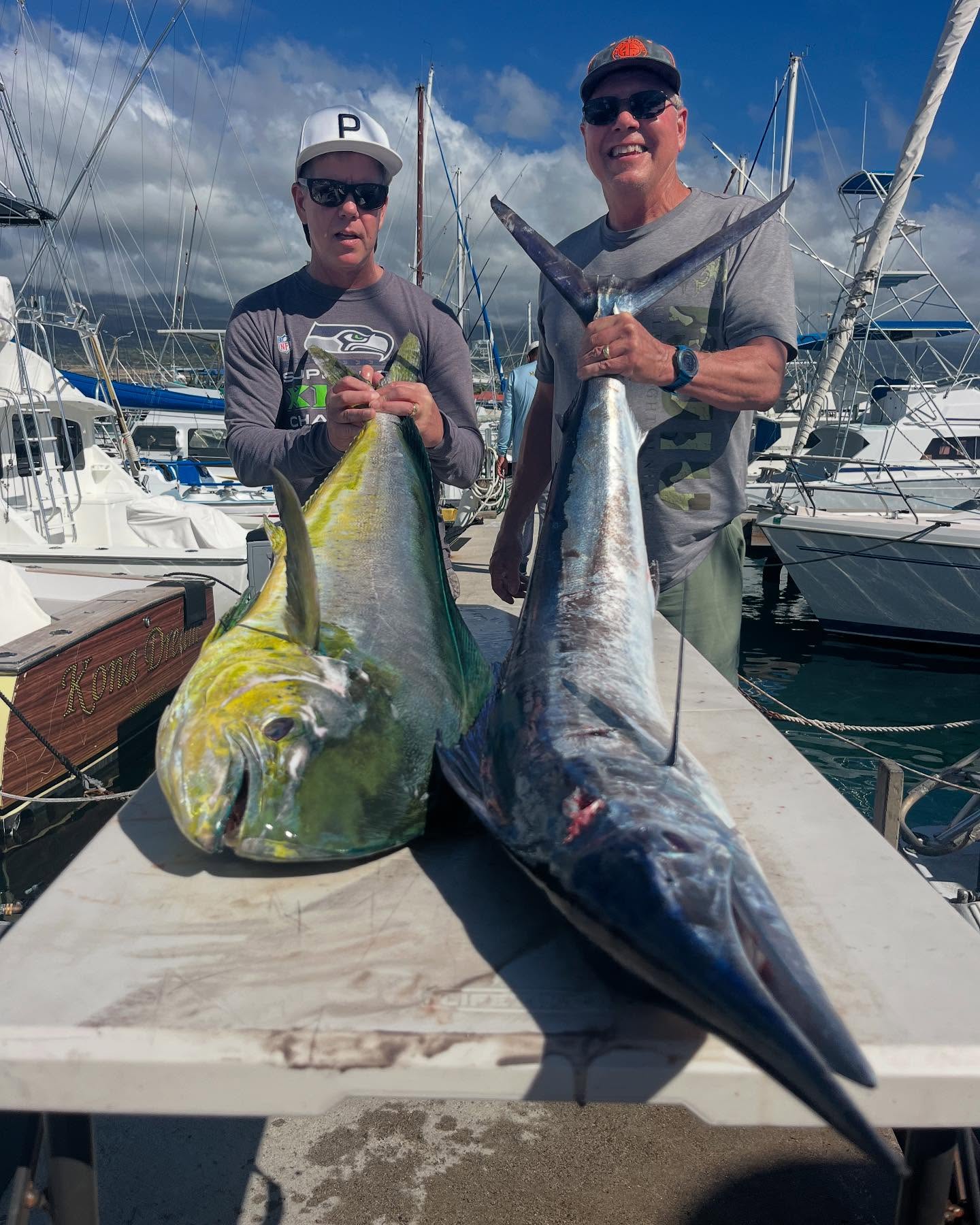 Six-hour offshore fishing charter boat on Kona coast waters with fishing equipment and crew