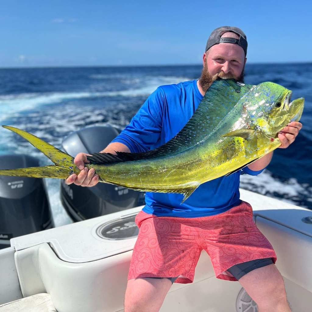 One fisherman holding a 25-inch fish in SC