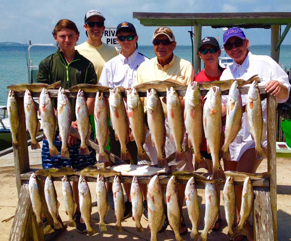 A group of 6 people fishing for 24 redfish at South Padre Island