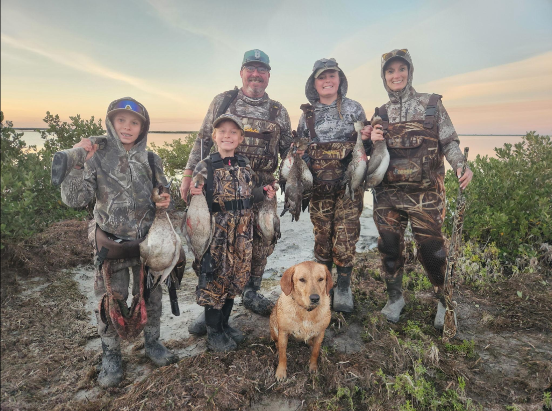 Group of 6 people fishing and hunting in South Padre Island