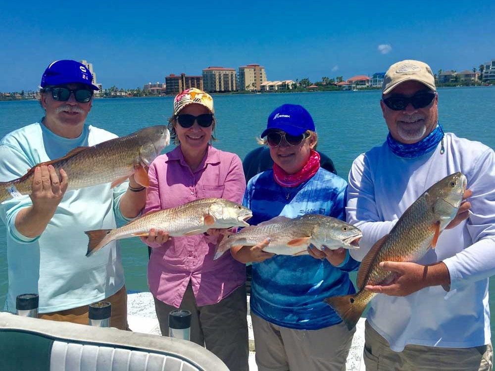 Family bay fishing trip with guide on calm inshore waters near South Padre Island