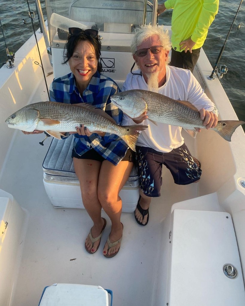 Two redfish caught by two anglers in St. Augustine