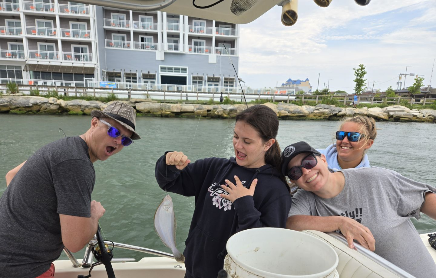 4 people enjoying ocean fishing in Ocean City