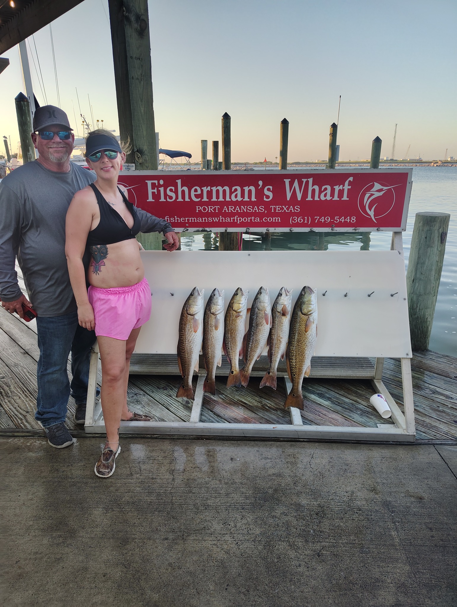 Six redfish displayed on cleaning station at Fisherman's Wharf in Rockport TX