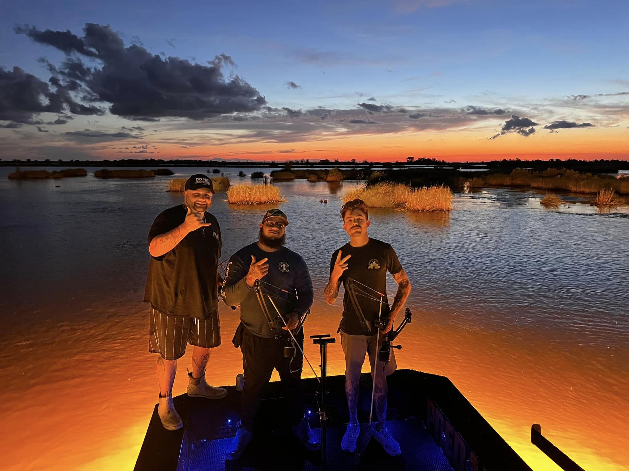 Three people enjoying a fishing trip in Lafitte