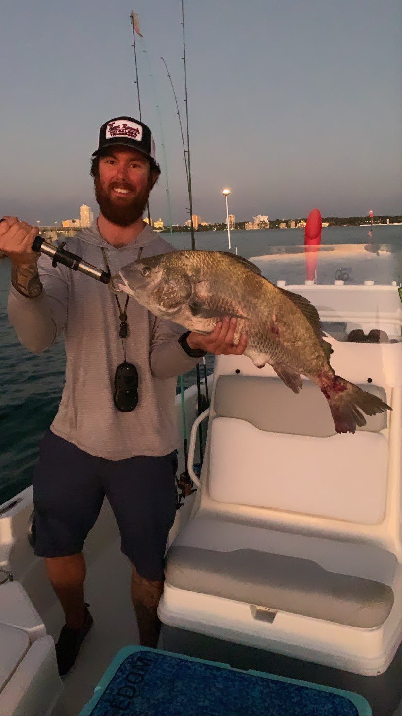 Angler holding a 23-inch fish in FL