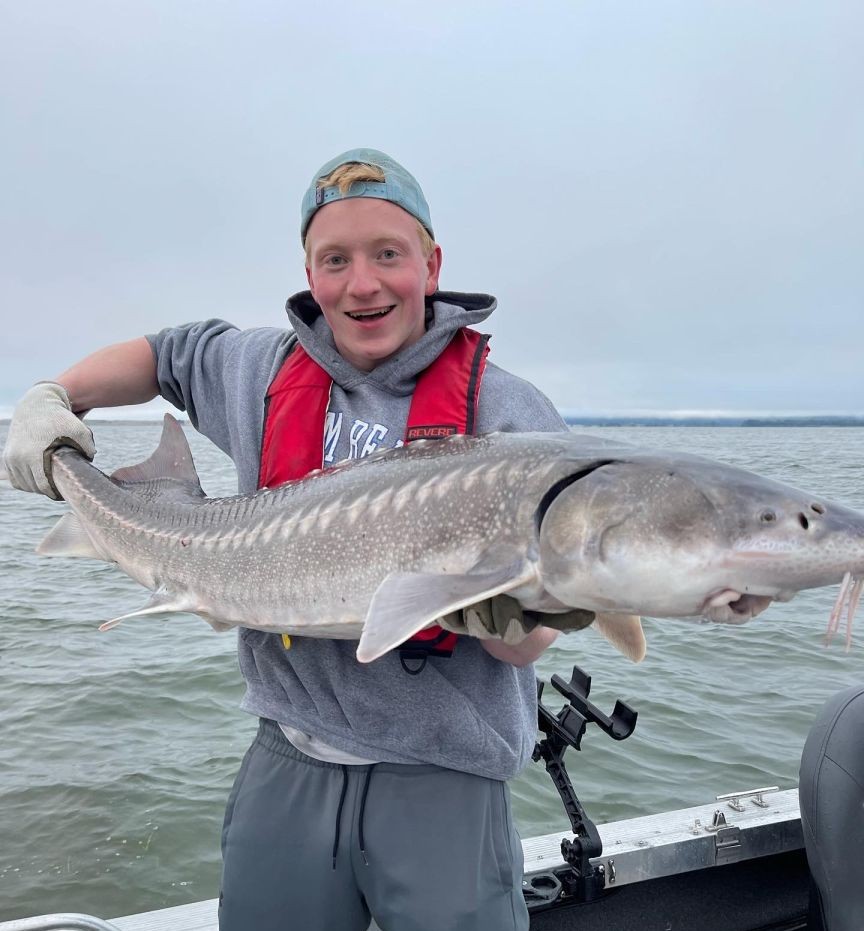 Portland Oregon sturgeon fishing charter boat on Columbia River with guide and anglers