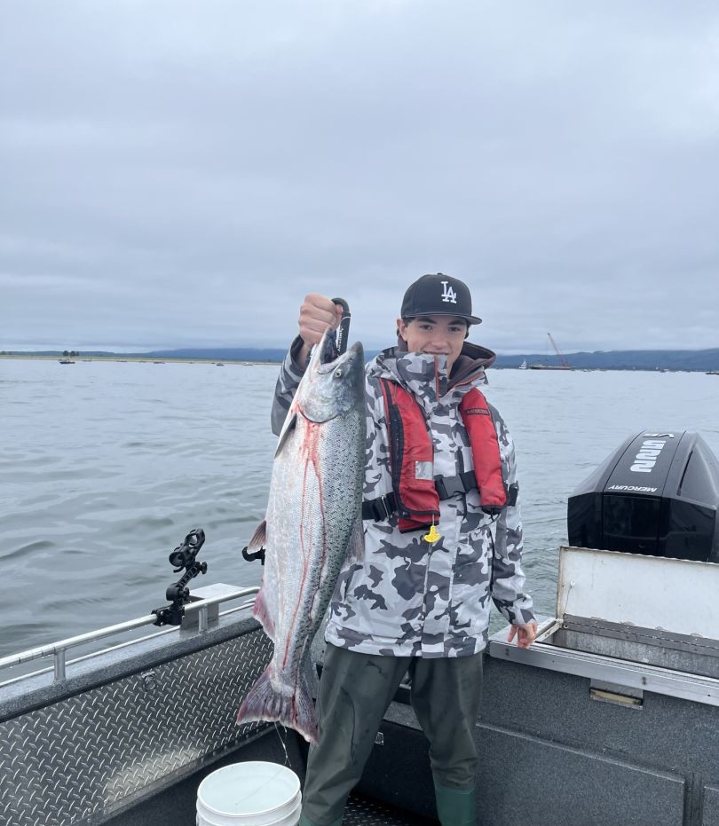 Private salmon fishing charter boat on Columbia River near Portland Oregon with anglers aboard