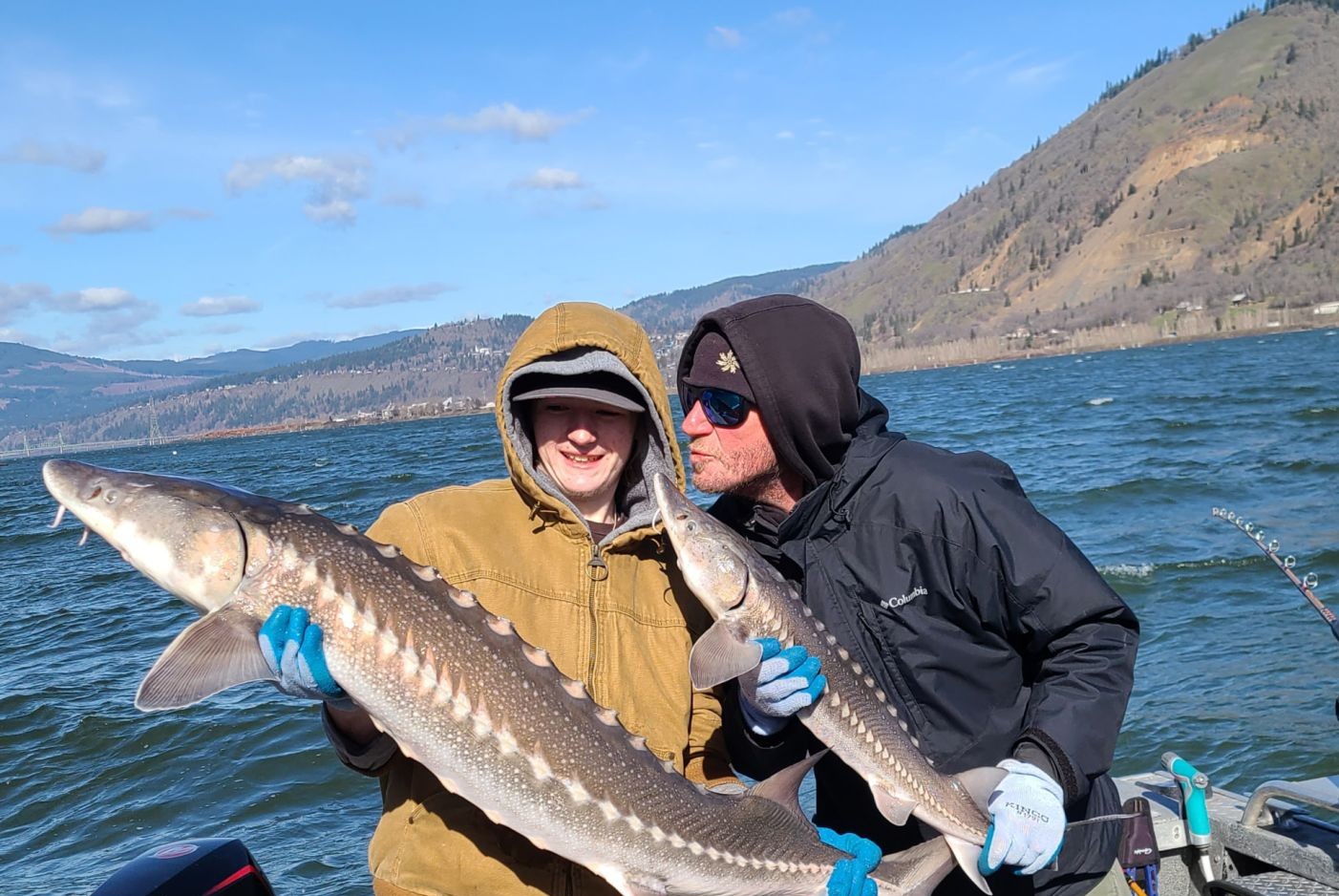 Portland Oregon sturgeon fishing charter boat on Columbia River with anglers