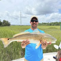Angler with a large fish in Mount Pleasant