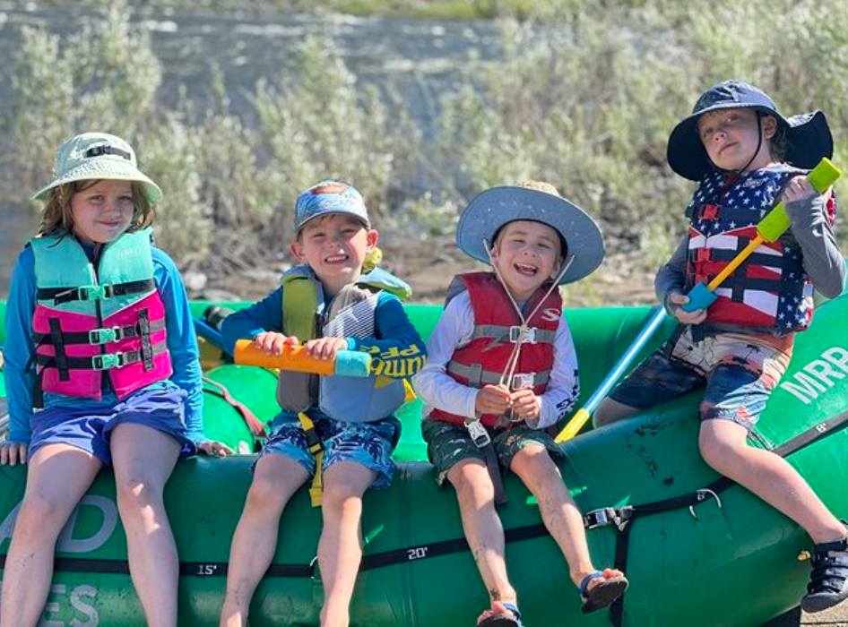 Four people enjoying water sports in Grants Pass
