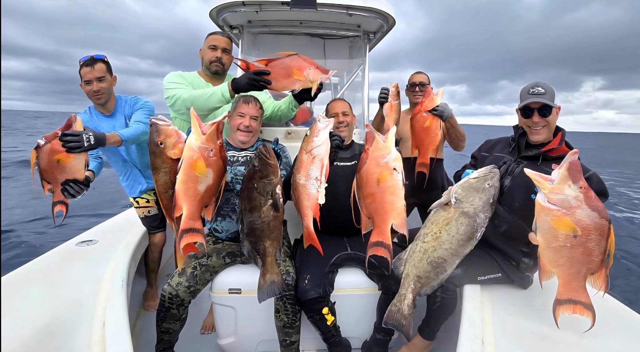 Successful fishing charter displaying hogfish, gag grouper, red grouper, and mutton snapper catch from North Palm Beach FL waters