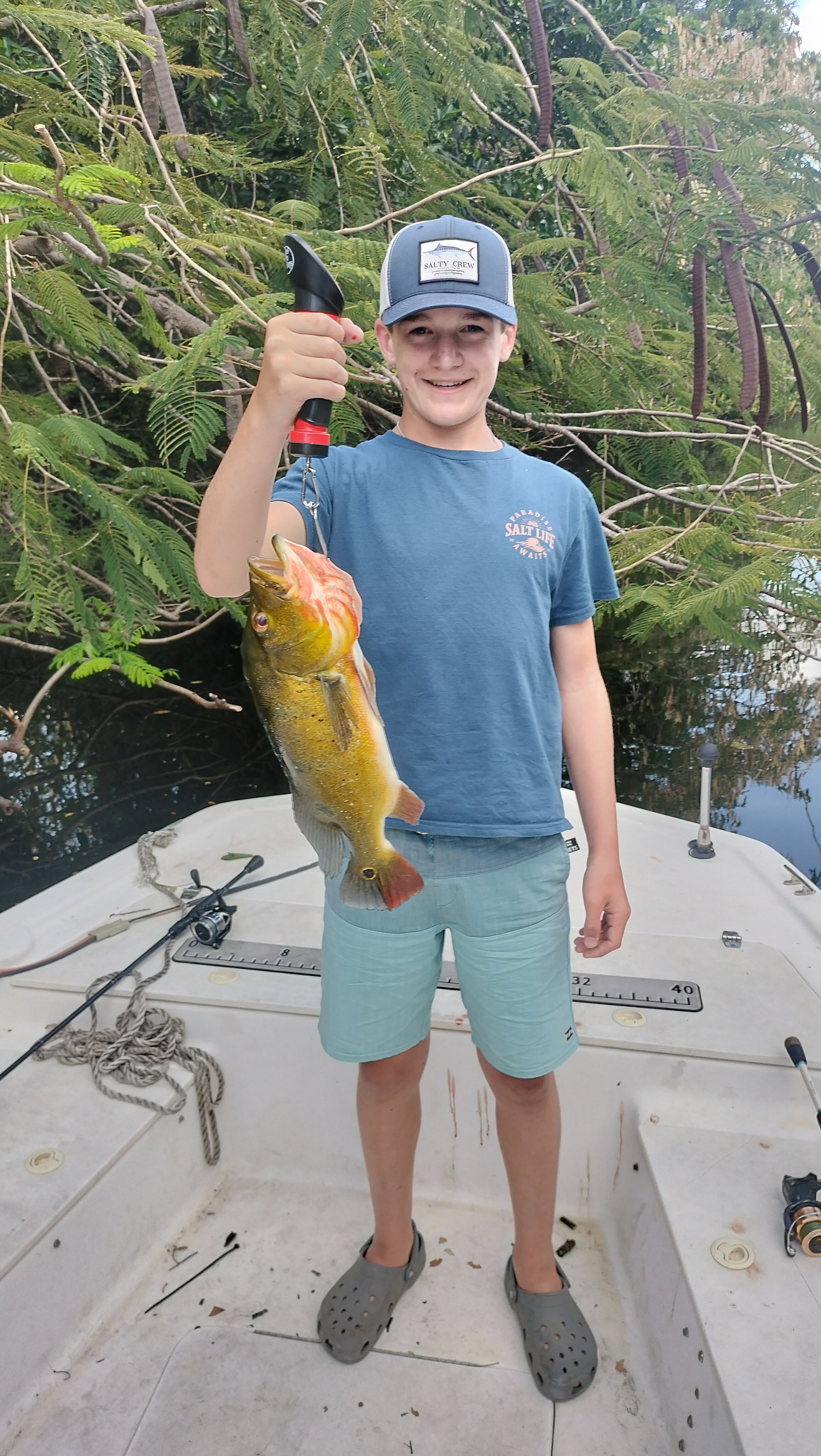Peacock bass catch displayed on fishing boat in North Palm Beach FL