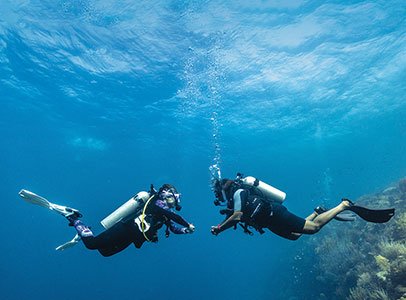 Scuba diver practicing buoyancy control underwater in West Palm Beach diving certification course