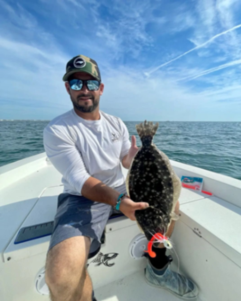 Angler with a 15-inch fish in Hampstead
