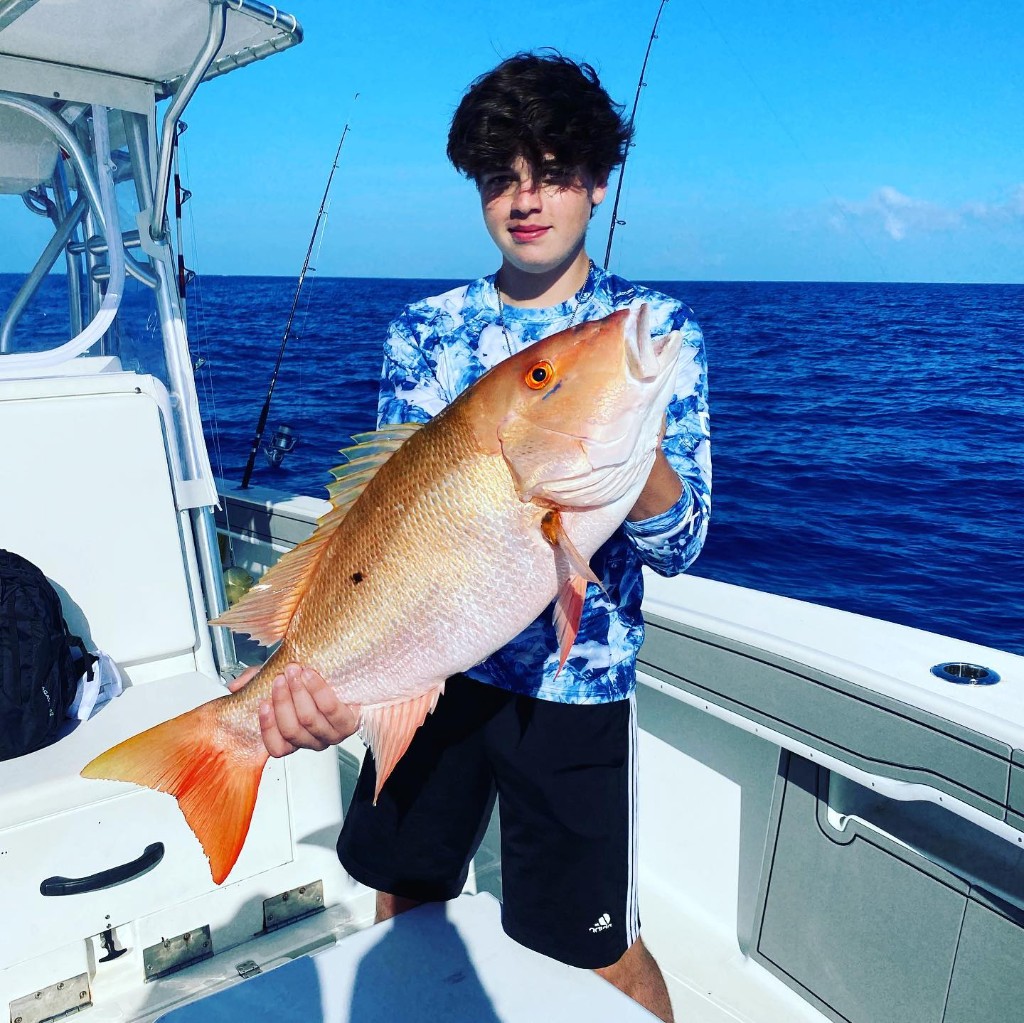 A Mutton Snapper fish measuring 22 inches, caught in FL