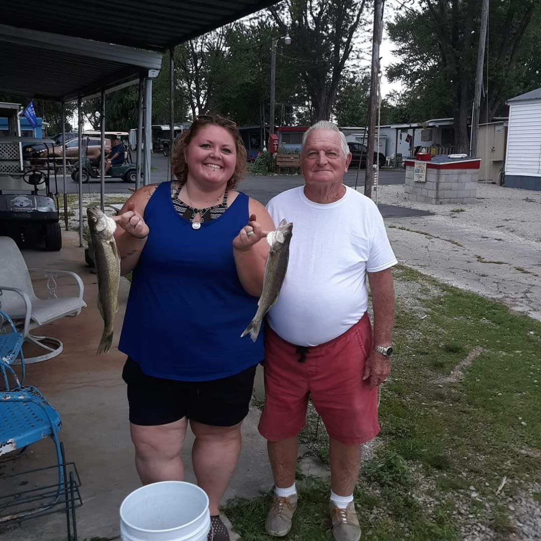 Two people fishing at lakeside in Marblehead