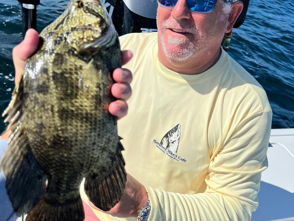 Angler with a 13-inch fish in FL