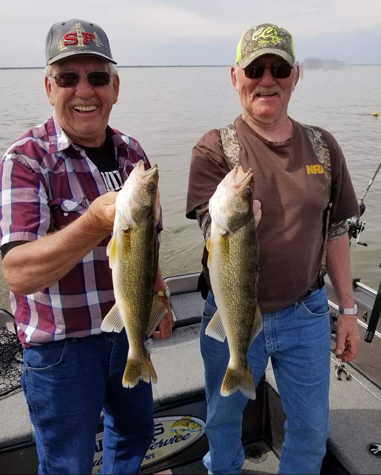 Two anglers fishing in the waters of Green Bay