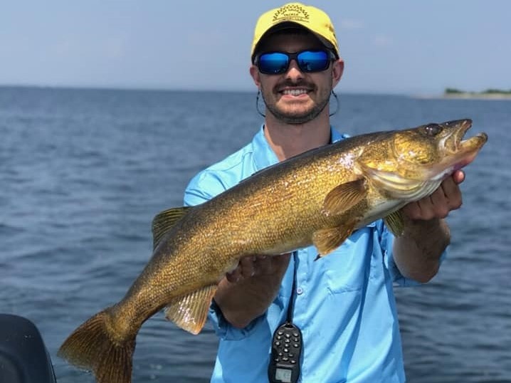 One fisherman holding a 25-inch fish in Green Bay
