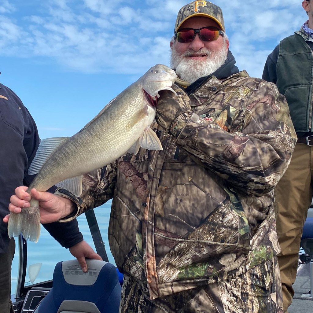 Angler holding fish in Erie