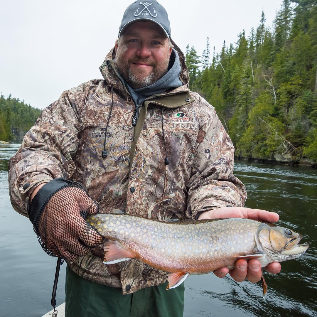 Photograph of a person fishing for a single brook trout in ON