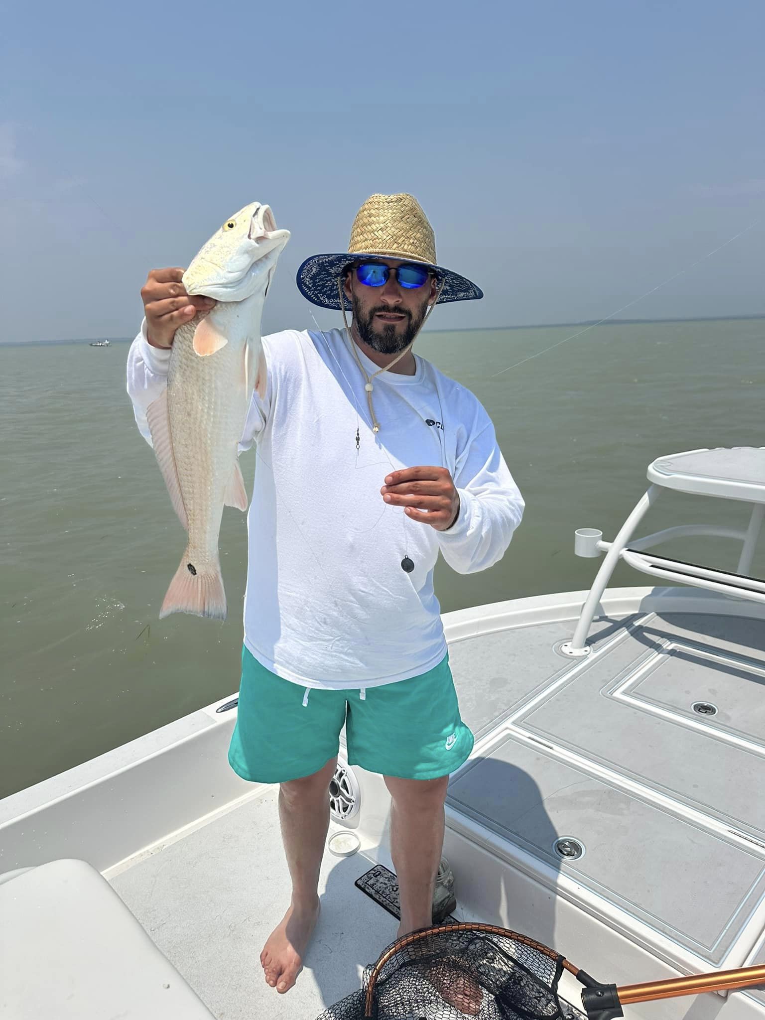 A person fishing in TX with a big fish