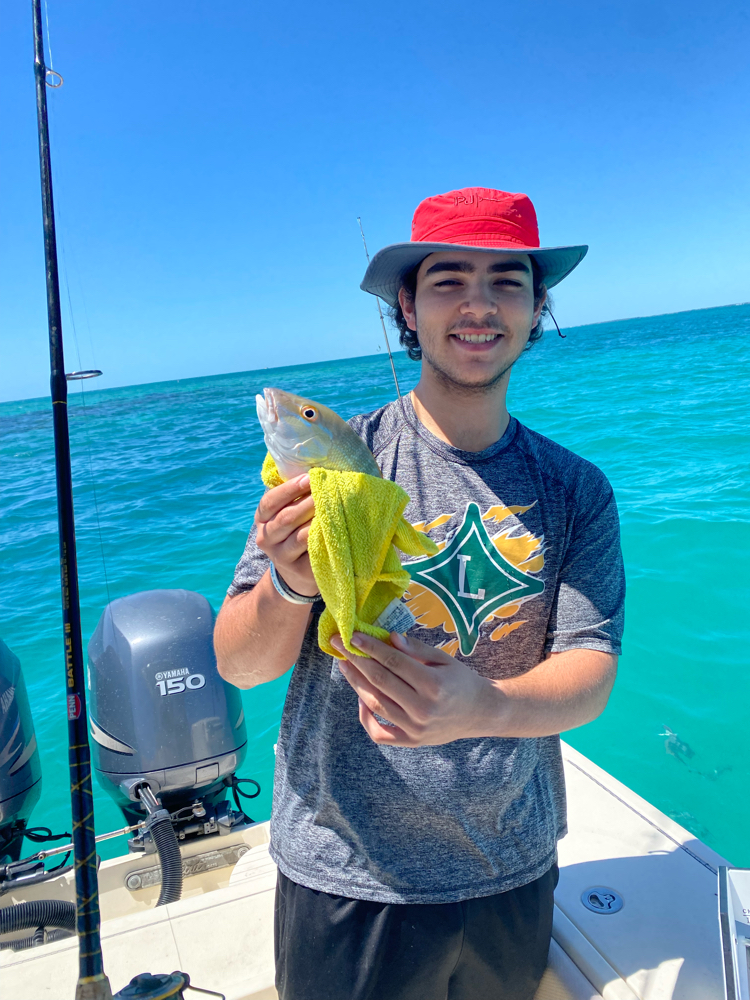 A person fishing in the waters of Key Largo