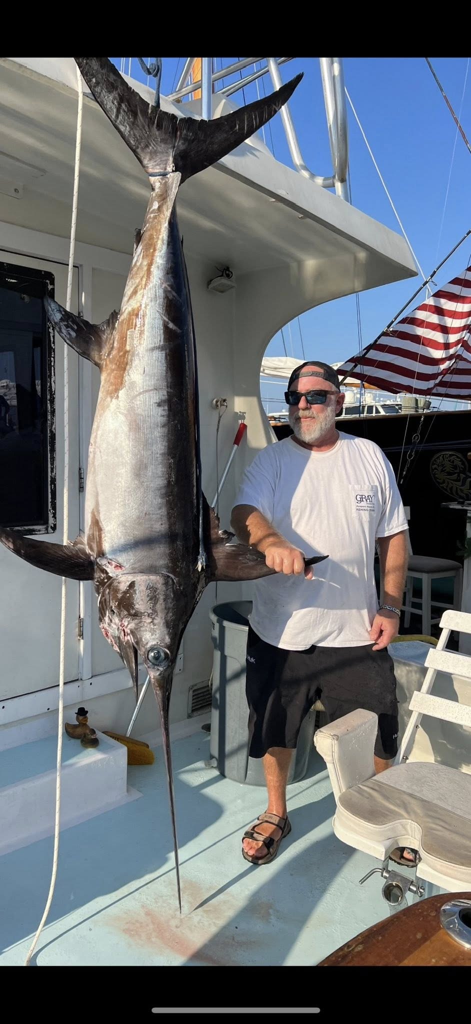 Large swordfish caught on fishing charter in Key West FL displayed on boat deck