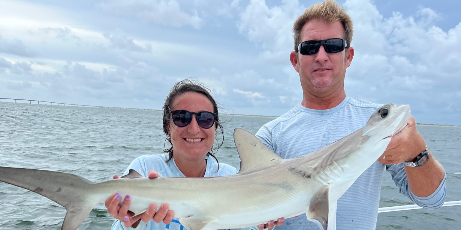 Outer Banks nearshore fishing charter boat with anglers targeting bluefish and Spanish mackerel